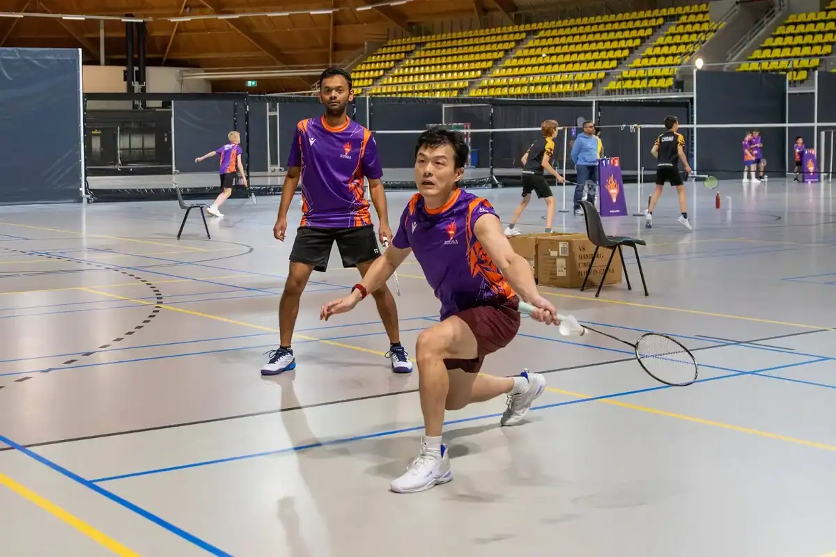 Rudra United players in a rally at Indoor Sport Centrum Eindhoven